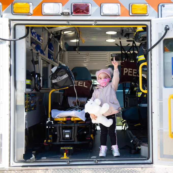 Photo of a small girl inside of an ambulance