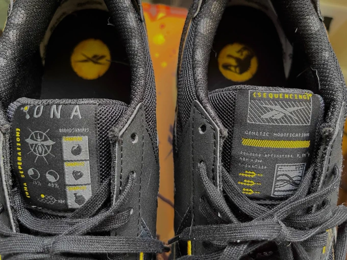 The tops of the Jurassic World Reeboks, with DNA and Sequencing imagery.