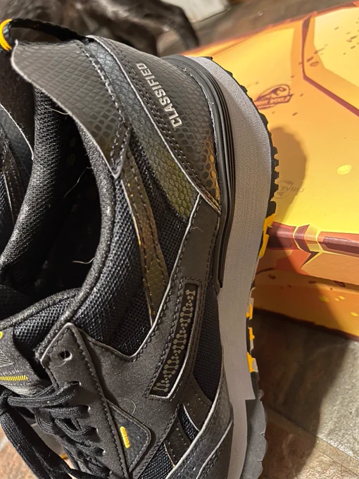 The sides of the Jurassic World Reeboks, with the DNA double helix logo.