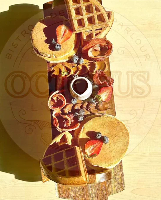 Example grazing platter with waffles, pancakes, bacon, fruit and syrup. 