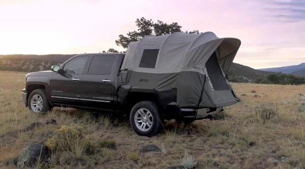 Photo of truck with portable truck tent set up on the bed of the truck.