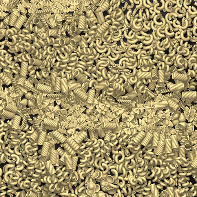 Top-down view of a lot of dried pasta, loosely grouped by shape into horizontal bands