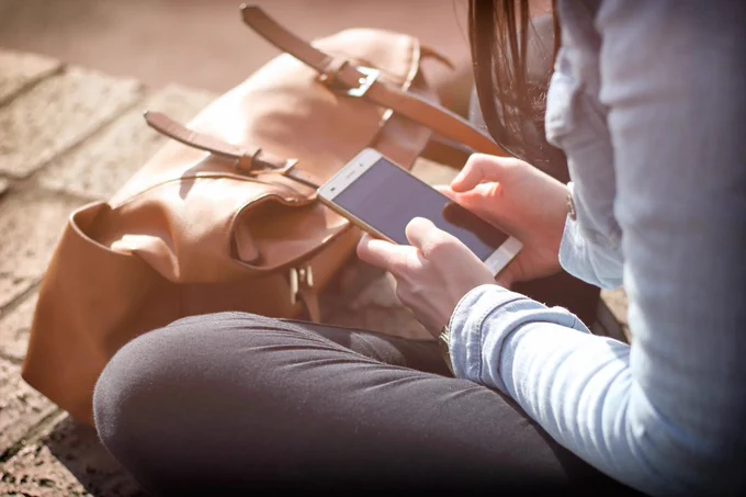 A person looking at their phone screen
