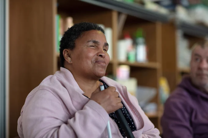 a woman who is vision impaired smiling