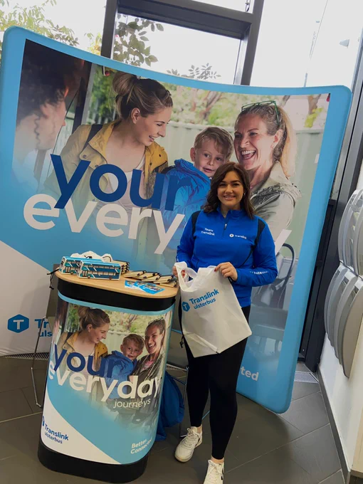 Team Translink standing with a Translink Ulsterbus bag