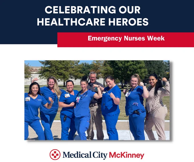 Six nurses in royal blue scrubs and other two ER employees are standing outside flexing their arms in the "strong" position. They are celebrating National ER Nurse Week.