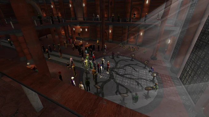 A crowd of players gather in a library in the Myst Online: Uru Live video game.