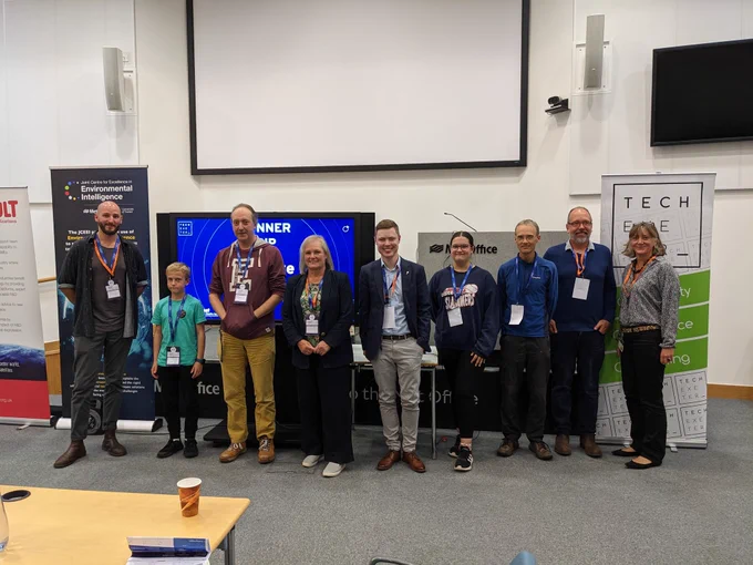 Photo of the team with the judging panel