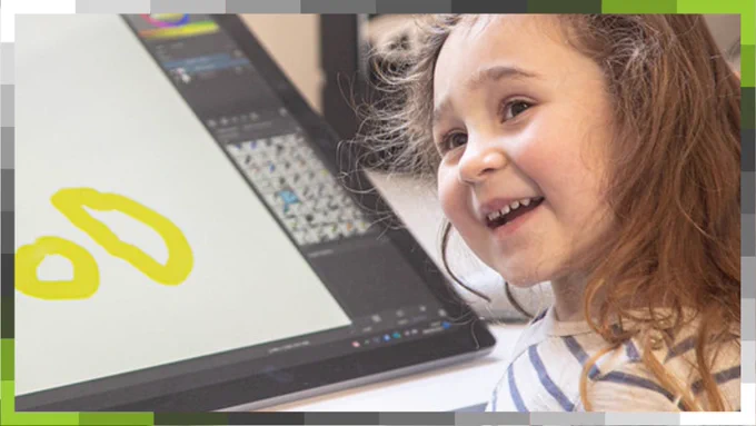 Child exploring The Lab by getting hands on with drawing on a Microsoft Surface Pro.