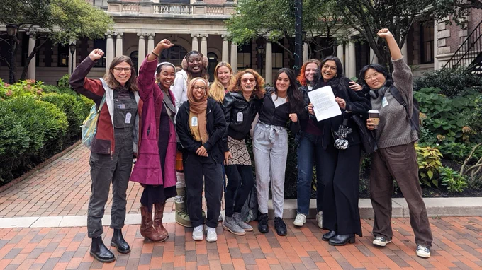 Barnard College RAs celebrating before they bring their signature petition to the president of the college