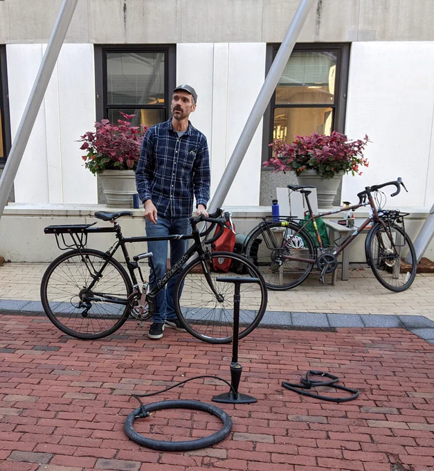 person doing demonstration on bike maintenance 