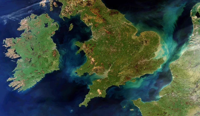 A satellite image of the UK and Ireland as taken from space.