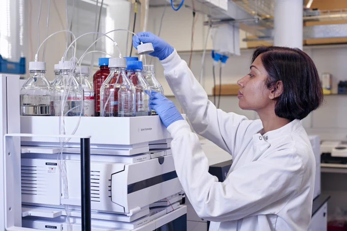 Scientist using laboratory equipment