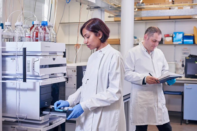Scientists using mass spectrometry equipment in University of Edinburgh laboratory