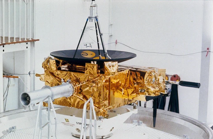 A solar spacecraft in an all white interior setting