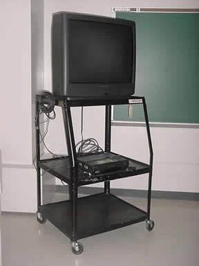old square tv on classroom rolling cart