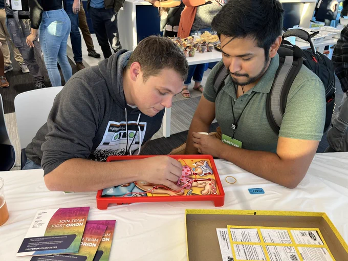 Little Rock Tech Feat attendees playing Operation game.