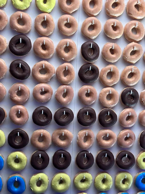 After the previous Vault Boy image we see a close up on how the pixels were made - it’s a wall of donuts with coloured icing.