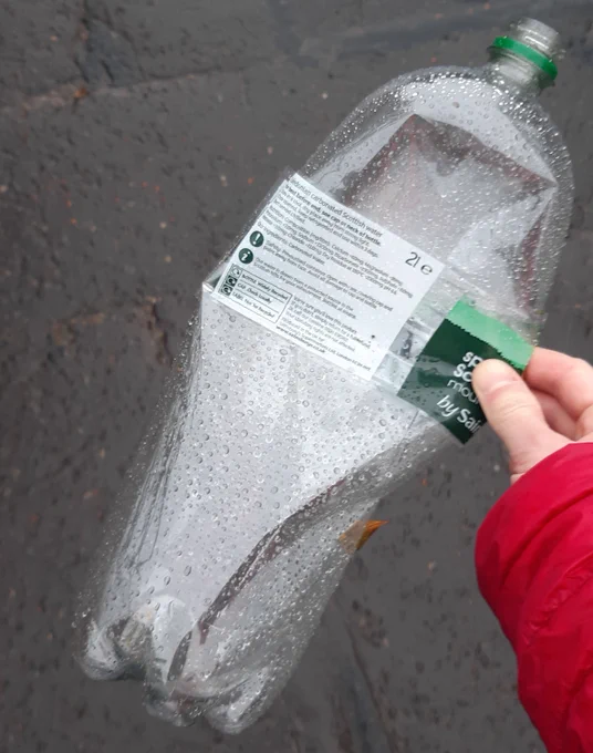 A plastic bottle found discarded on an Edinburgh street, that was broken down by bacteria and turned into vanillin.