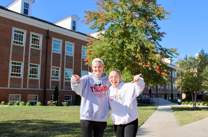 Two computer science students stand outside Bruner Hall at Tennessee Tech University.