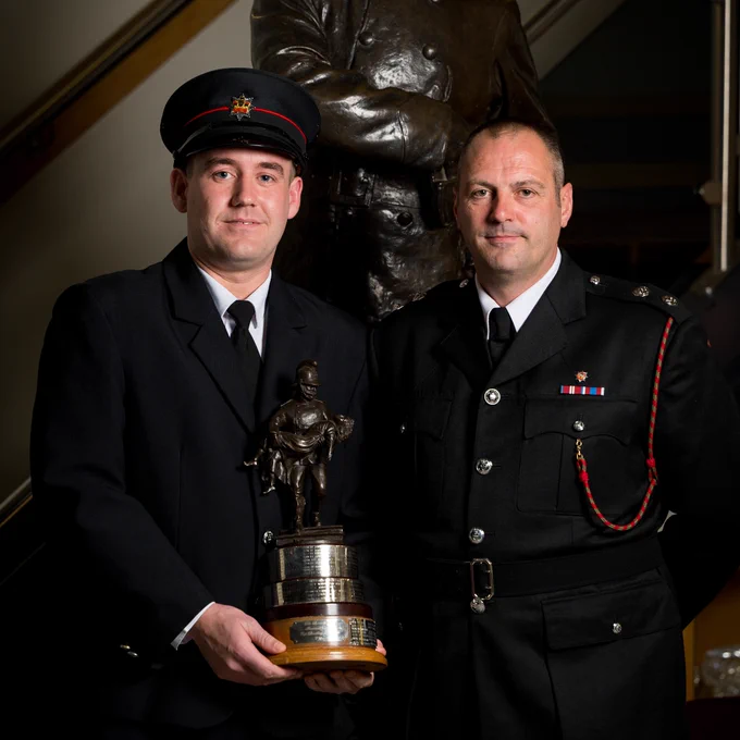 Trainee Firefighter Sean Pemberton pictured being awarded the Best Breathing Apparatus trophy, with Watch Commander Stuart Mayo
