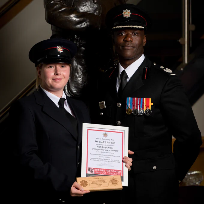 Trainee Firefighter Laura Barker pictured being awarded the First Responder Emergency Carer Award, with Deputy Chief Fire Officer Wayne Brown