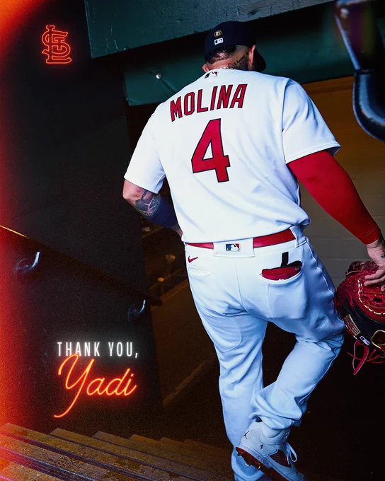 Yadier Molina walks down the stairs of the dugout to the Cardinals clubhouse.