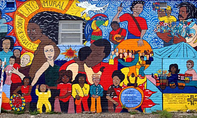 Image of a mural featuring multicultural illustrations of different people. 