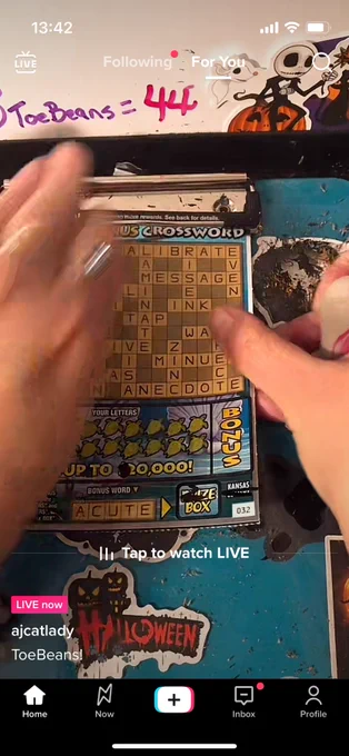 someboy removing a lottery ticket from a clipboard