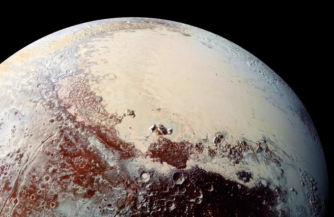 This high-resolution image captured by NASA’s New Horizons spacecraft combines blue, red and infrared images taken by the Ralph/Multispectral Visual Imaging Camera (MVIC). Pluto’s surface shows a remarkable range of subtle colors, enhanced in this view to a rainbow of pale blues, yellows, oranges, and deep reds. The bright expanse is the western lobe of the “heart,” informally known as Tombaugh Regio. The lobe, informally called Sputnik Planum, has been found to be rich in nitrogen, carbon monoxide, and methane ices.

Credit: NASA/JHUAPL/SwRI