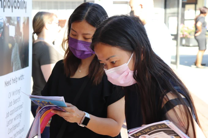 Two young women searching for work at last years event. 