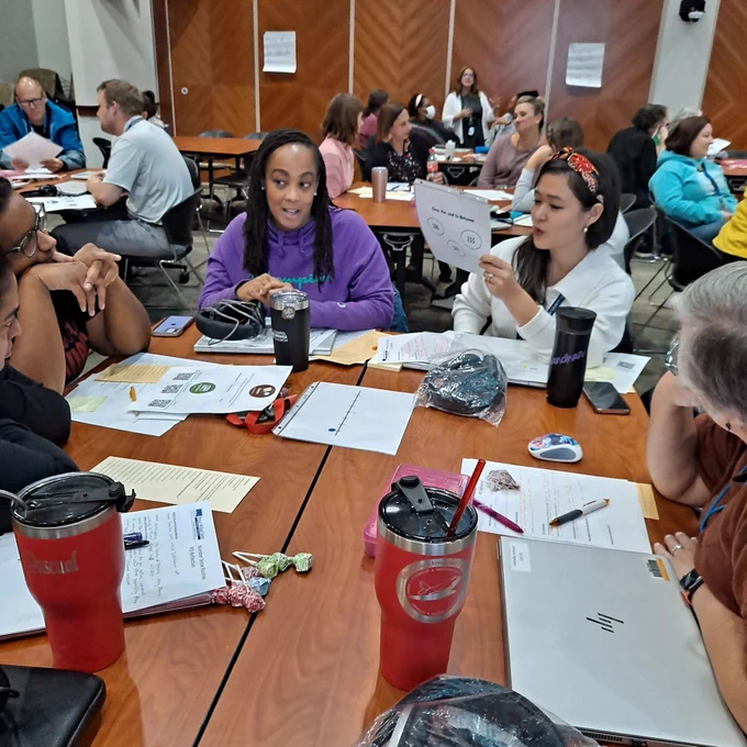 Table of teachers engaging in a number routine (close, far, and in between)/practicing being the teacher