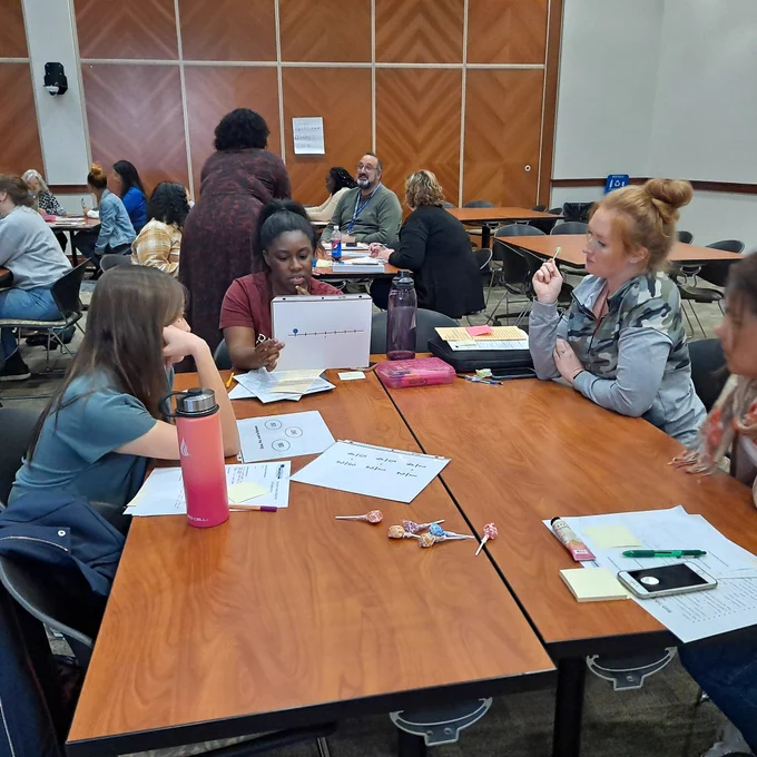 Table of teachers engaging in a number routine (number line)/practicing being the teacher
