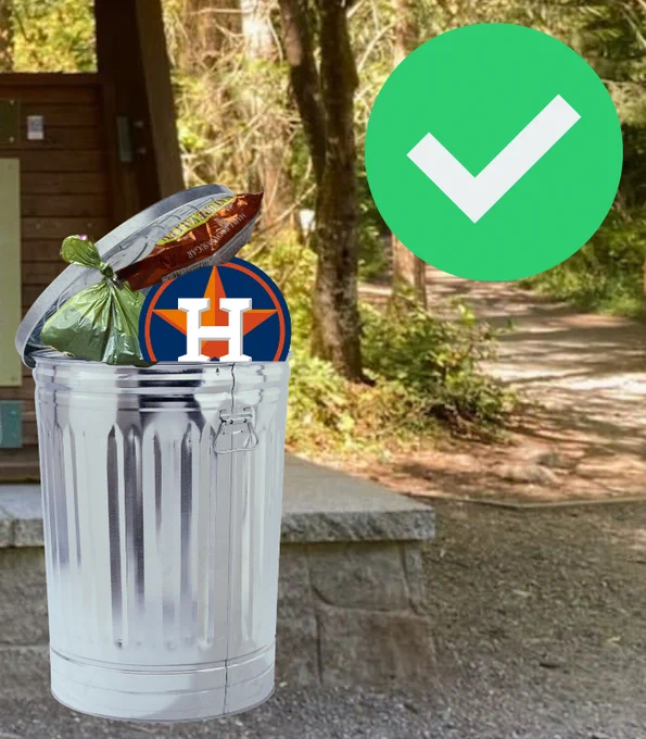 A trashcan at a trailhead sits happily full of the items that belong in it - such as dog poop bags, granola bar wrappers, and logos of opposing baseball teams. A big green checkmark beams down from the corner. The trash can lets out a belch. It is hungry for more dog poop bags. Feed it.