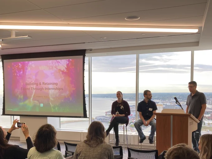 Gerry Heindenreich (at podium), Angela Bewick and Colton Watkins presenting Building and Retaining Talent through Internships as part of MKE Tech Week on Oct. 6, 2022.