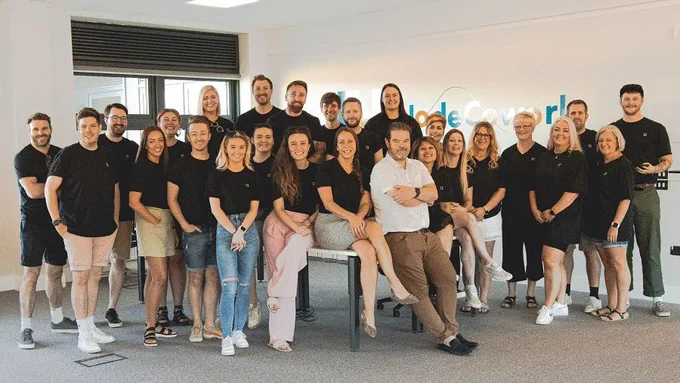 A photo of the full TownSq team smiling at a team retreat
