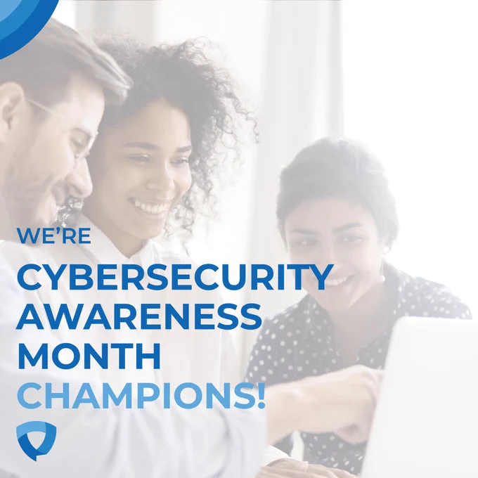 Semitransparent photo of a man and two women gathered in front of a computer, smiling. Caption reads "we're cybersecurity awareness month champions!"