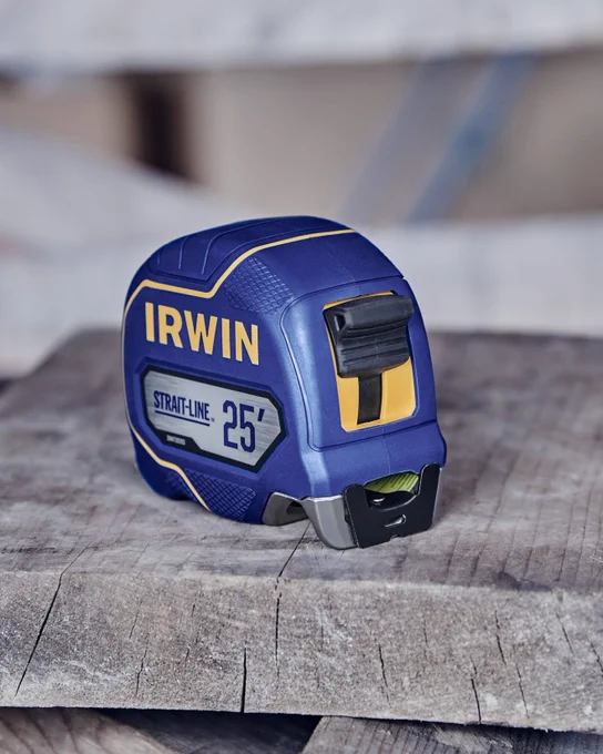 Strait-line® Tape Measure on top of a piece of wood.
