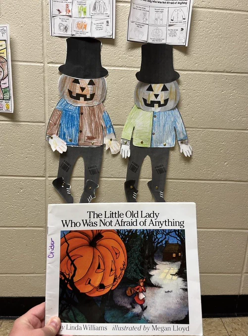 "Pumpkin man" paper designs colored and assembled by students 