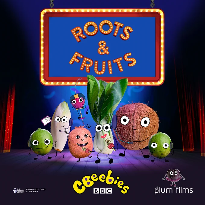 Different vegetables and fruits including a pak choi, bristle sprouts and a coconut with cartoon eyes and mouths drawn on them stand on a stage. The text above the stage reads "Roots & Fruits". CBeebies logo and plum film logo are featured.