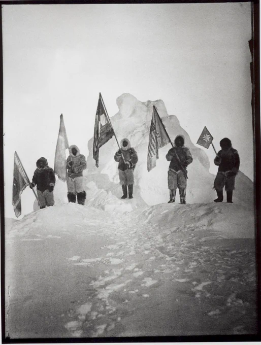 Photograph of the Robert Peary Sledge Party Posing with Flags at the North Pole