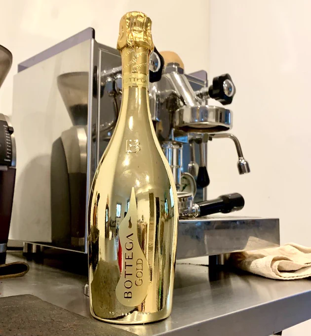 Gold bottle of sparkling wine. 