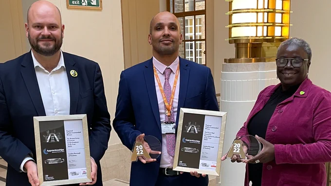 Image of Mayor, Apprenticeships Programme Manager Andre and Councillor Williams holding the recent awards won by the apprenticeship programme.
