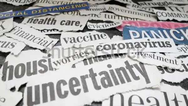 Images of words ripped from newspaper headlines, including uncertainty, coronavirus, vaccine