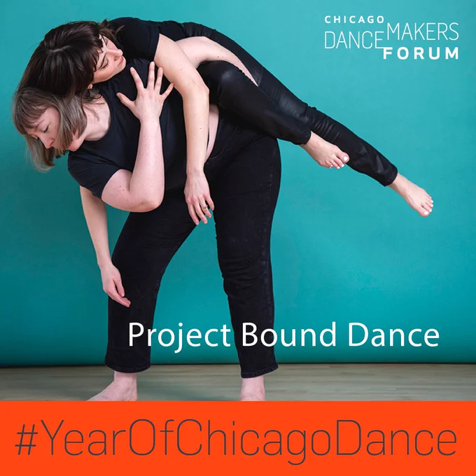 Dancers wearing various black clothing garments in a partnered shapes against a teal background.
