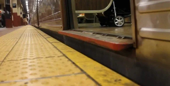 A photo demonstrating the gab between MTA station and train car entrance.