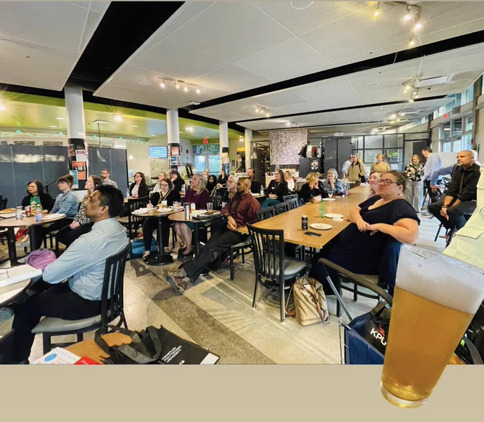 An audience listening to a PechaKucha.