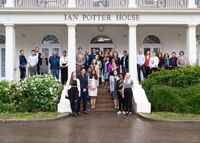 Some of the staff of the Australian Academy of Science secretariat stand on the steps of Ian Potter House in Canberra. 