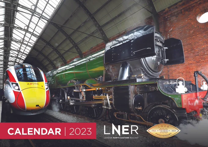Flying Scotsman steam train next to LNER Azuma at Darlington with graphics infront sayin Calendar 2023. 