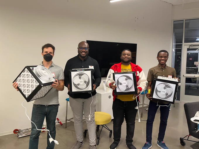 Students showing off just-completed filters